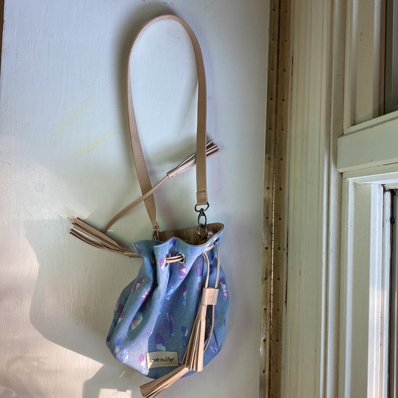 love this life blue bag with pink, magenta, and white feathers. convertible. - Picture 2 of 3